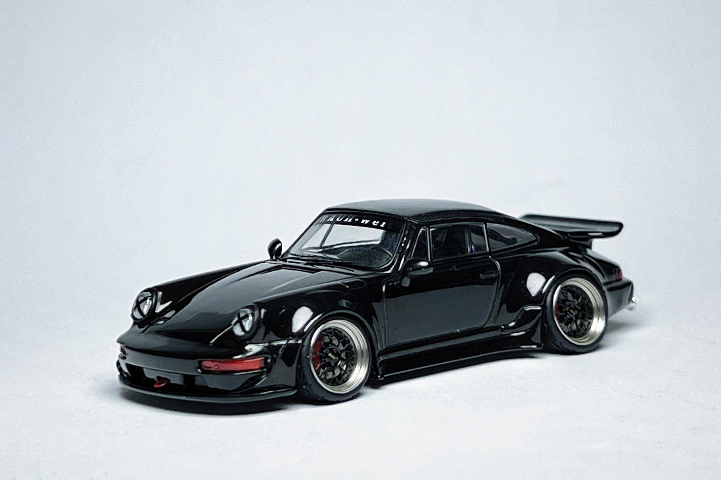 1:64 scale Flame Porsche RWB 964 Ducktail Black Bird custom diecast with deep-dish bearing wheels
