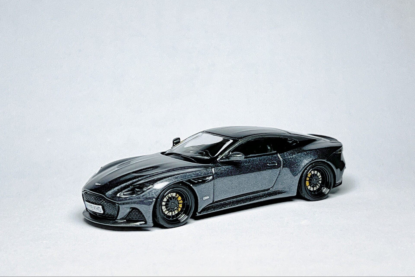 1:64 scale MINI GT Aston Martin DBS 007 No Time to Die 904 custom diecast with Devo wheels