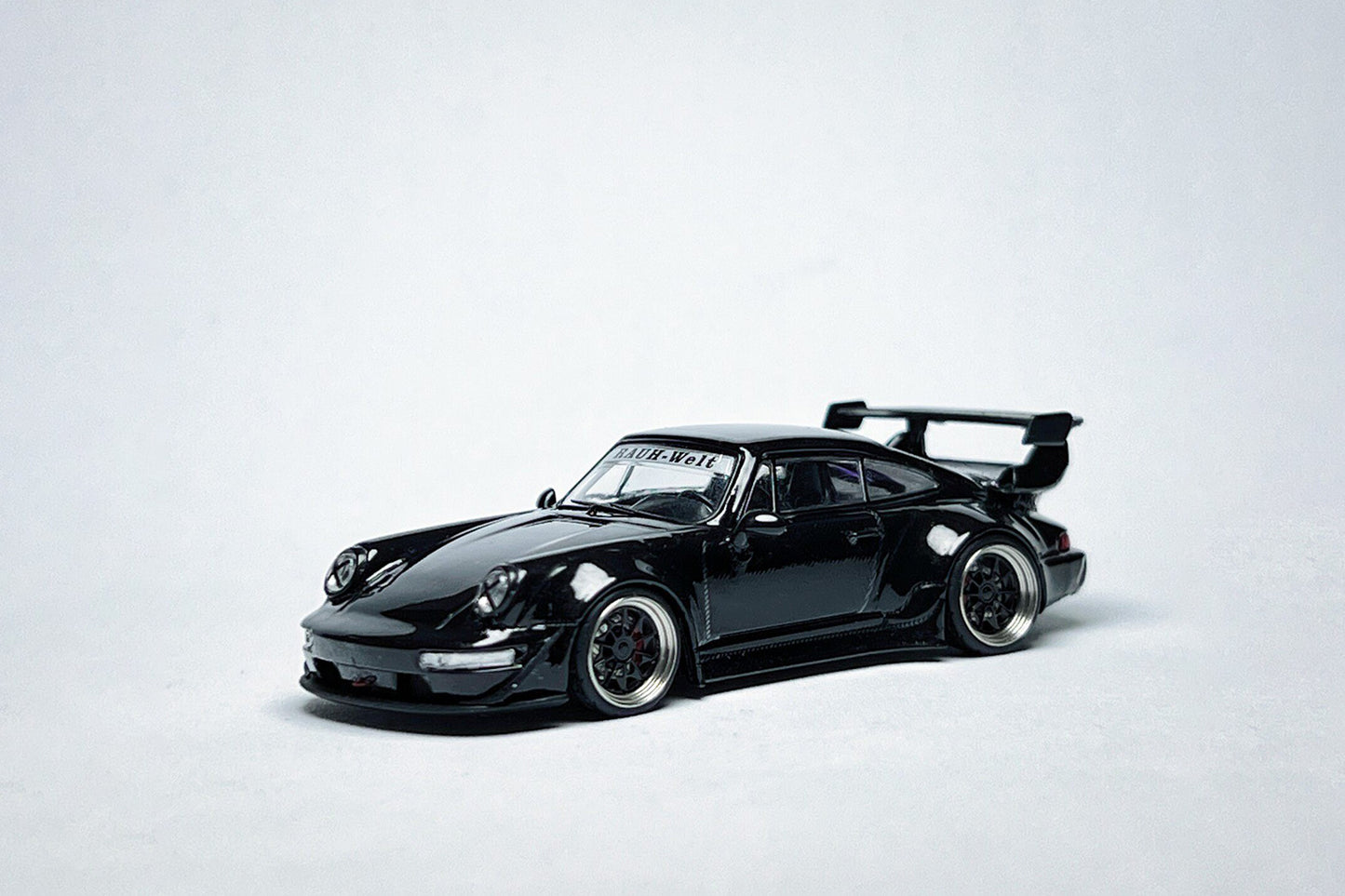1:64 scale Flame Porsche RWB 964 High Wing Black Bird custom diecast with deep-dish bearing wheels