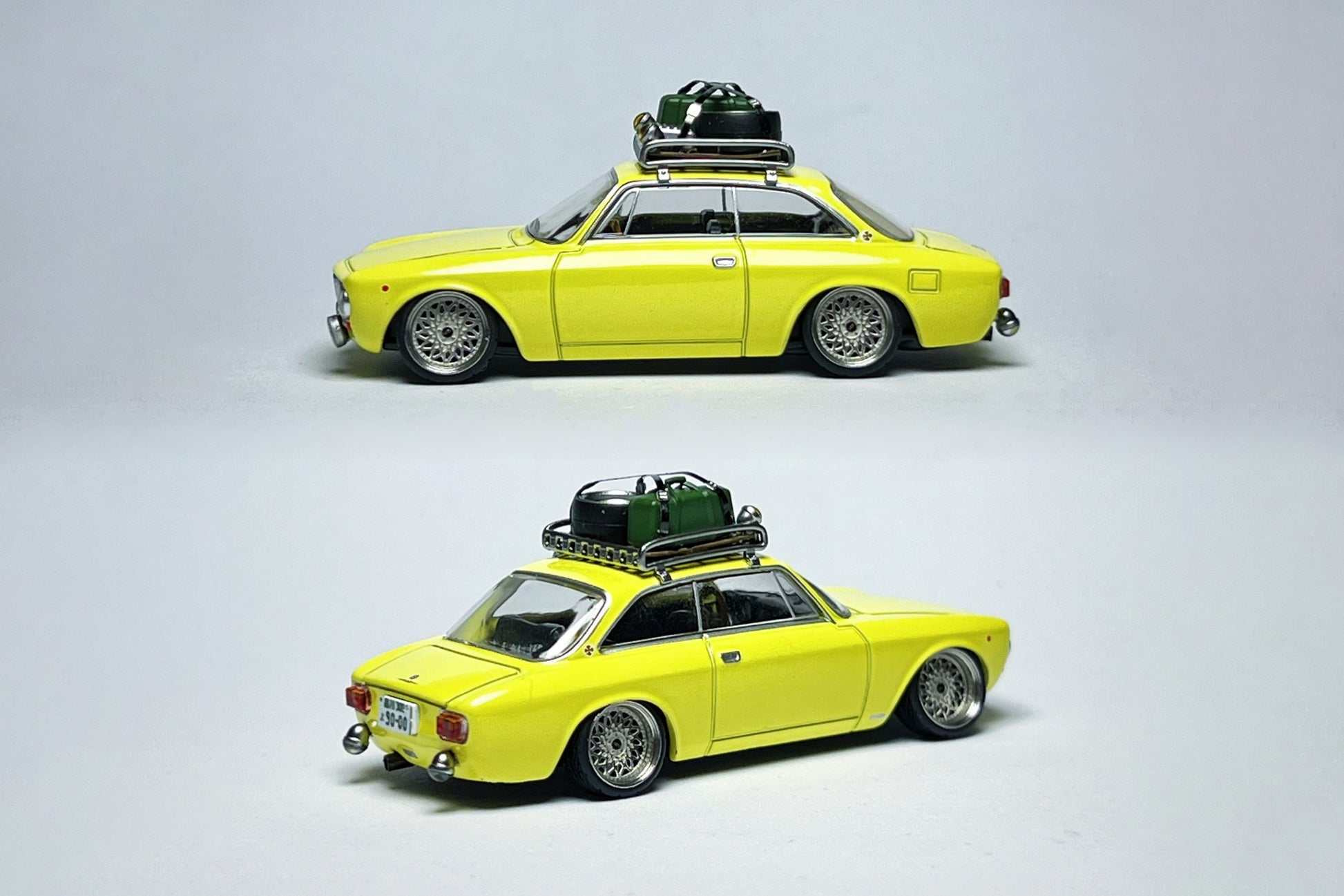 Custom 1:64 Alfa Romeo 155c yellow rally diecast model with visible race number markings