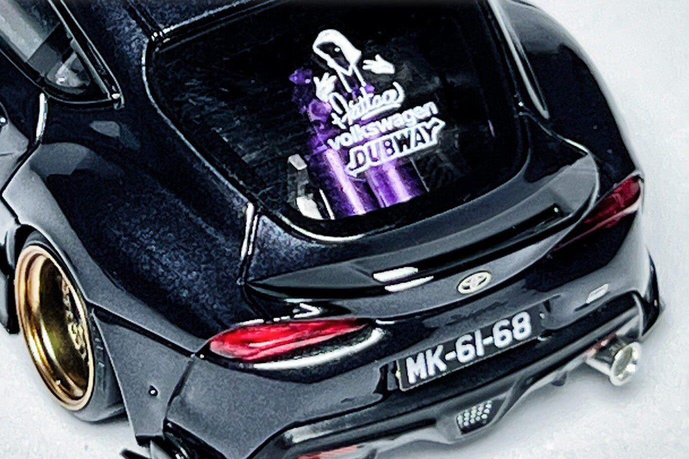Wheel and decal detail on custom 1:64 Toyota GR Supra A90 diecast model with deep-dish wheels