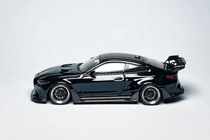 Custom 1:64 BMW G82 M4 ADRO widebody metallic black diecast model with deep-dish bearing wheels