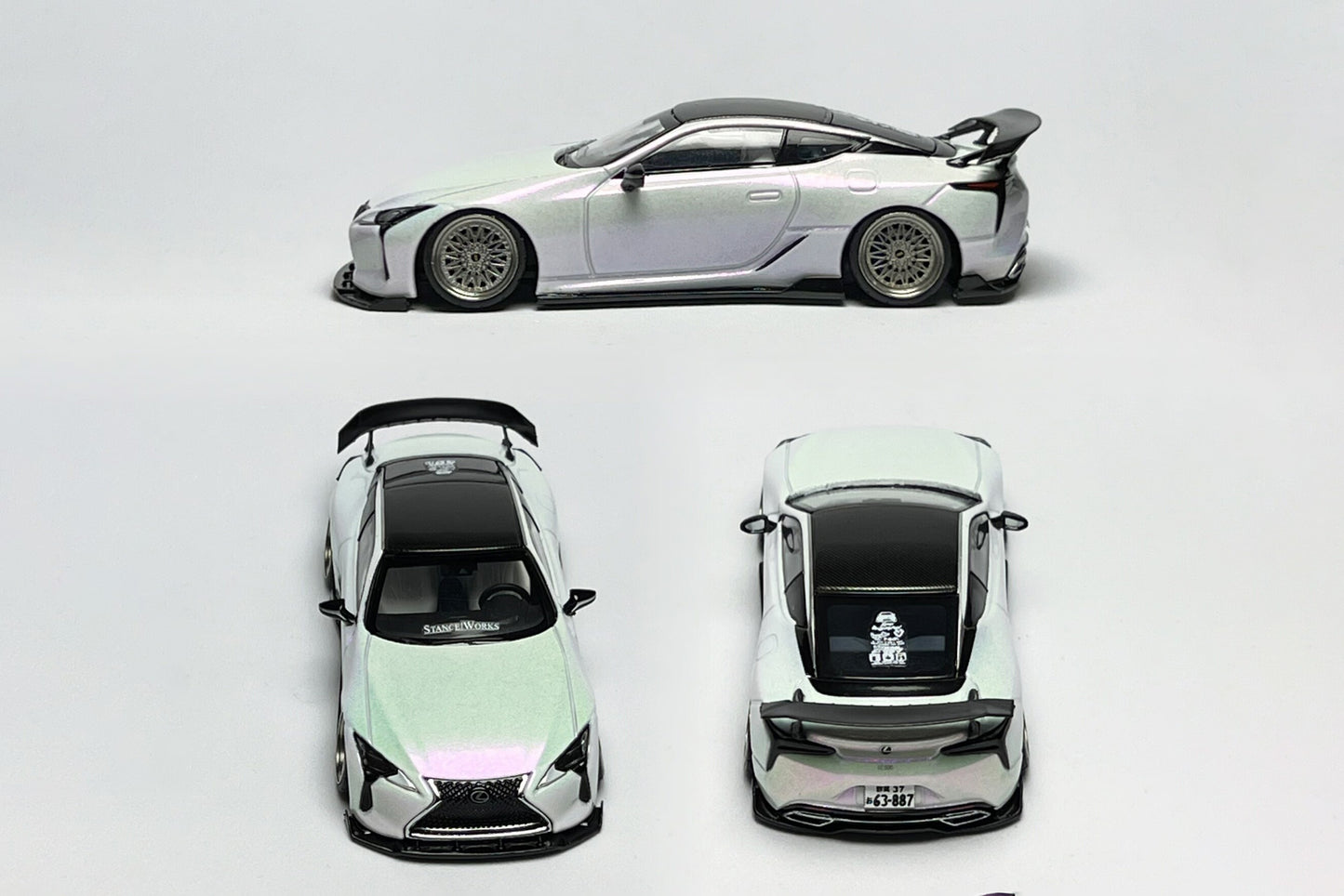 Custom 1:64 Lexus LC500 pearl white diecast model with visible StanceWorks livery