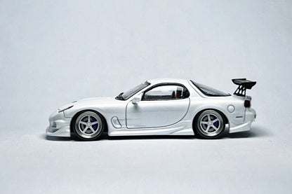 Custom 1:64 Mazda RX-7 VeilSide pearl white diecast model with deep-dish bearing wheels