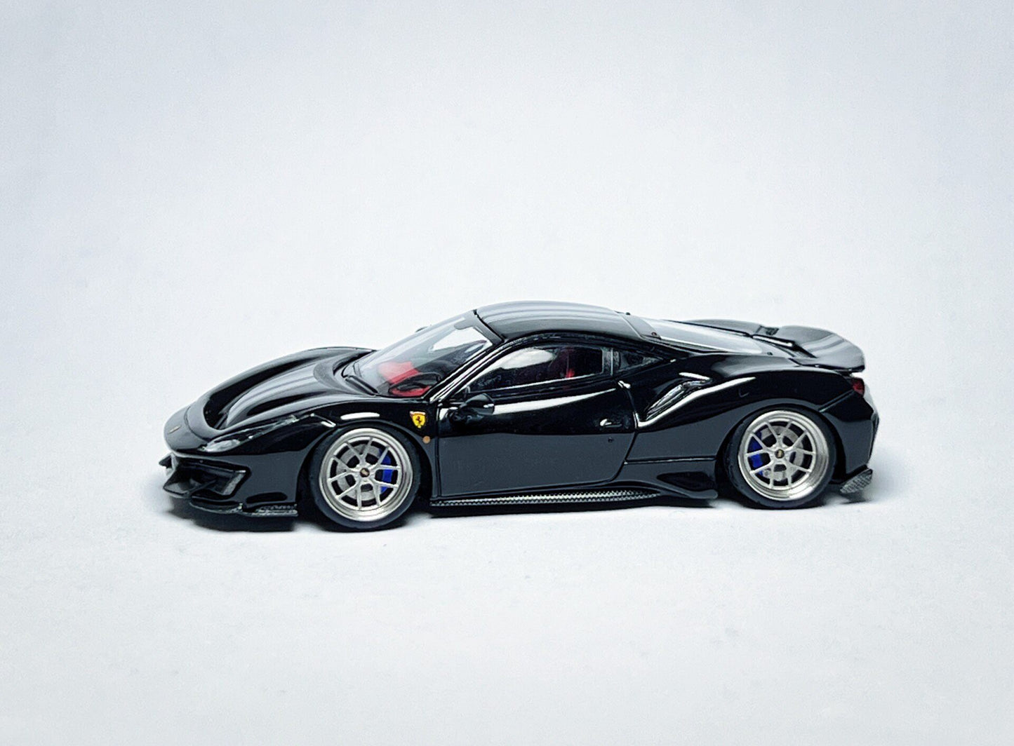 Custom 1:64 Ferrari 488 Pista black diecast model with deep-dish bearing wheels