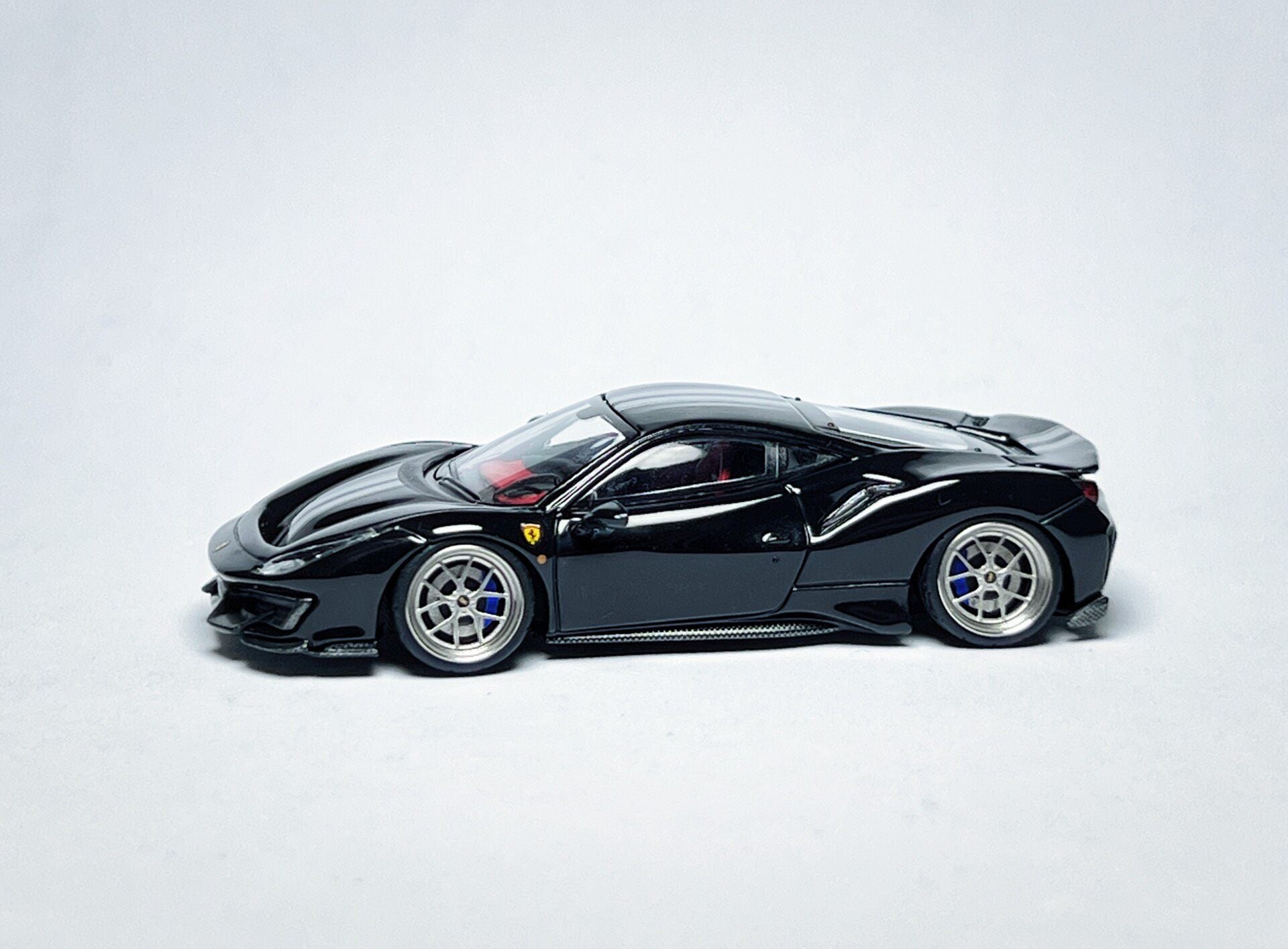 Custom 1:64 Ferrari 488 Pista black diecast model with deep-dish bearing wheels