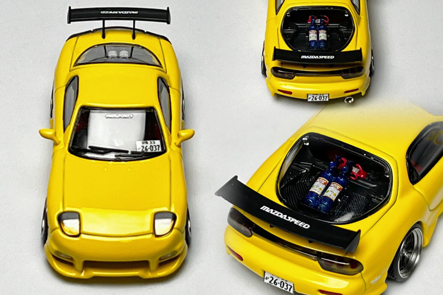 Custom 1:64 Mazda RX-7 VeilSide yellow diecast model with MAZDASPEED livery