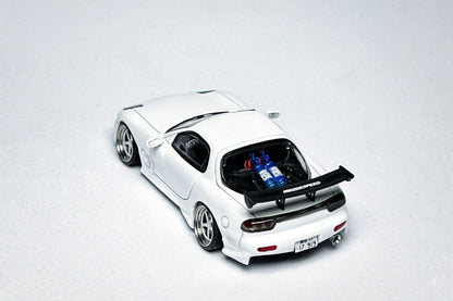 Custom 1:64 Mazda RX-7 VeilSide pearl white diecast model with visible text markings