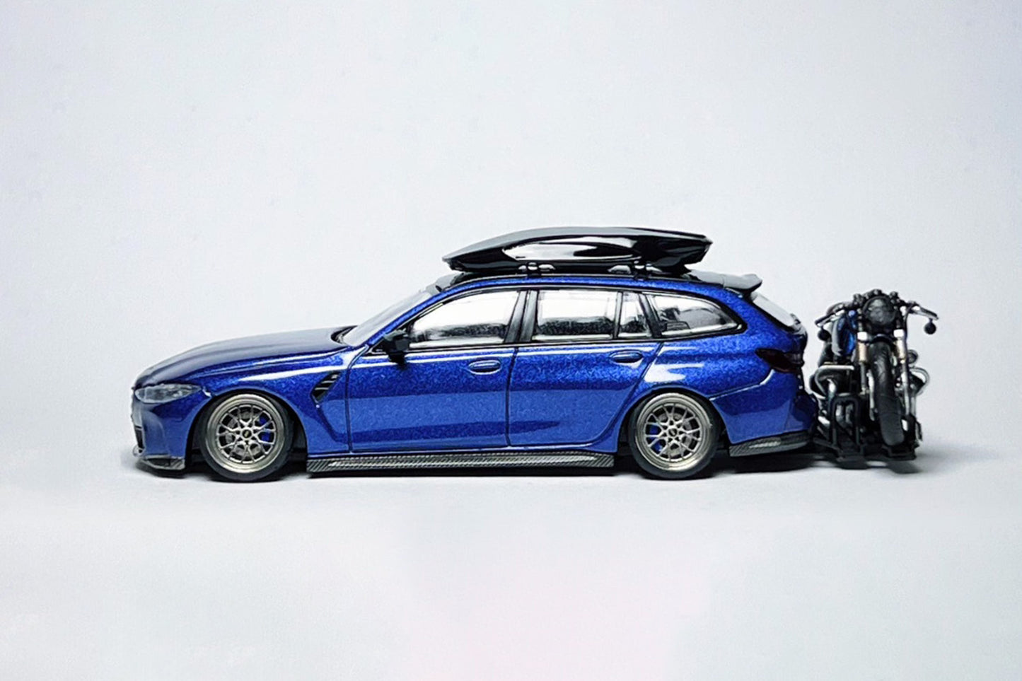 Custom 1:64 BMW M3 Touring 1090 diecast model with deep-dish wheels and roof cargo box