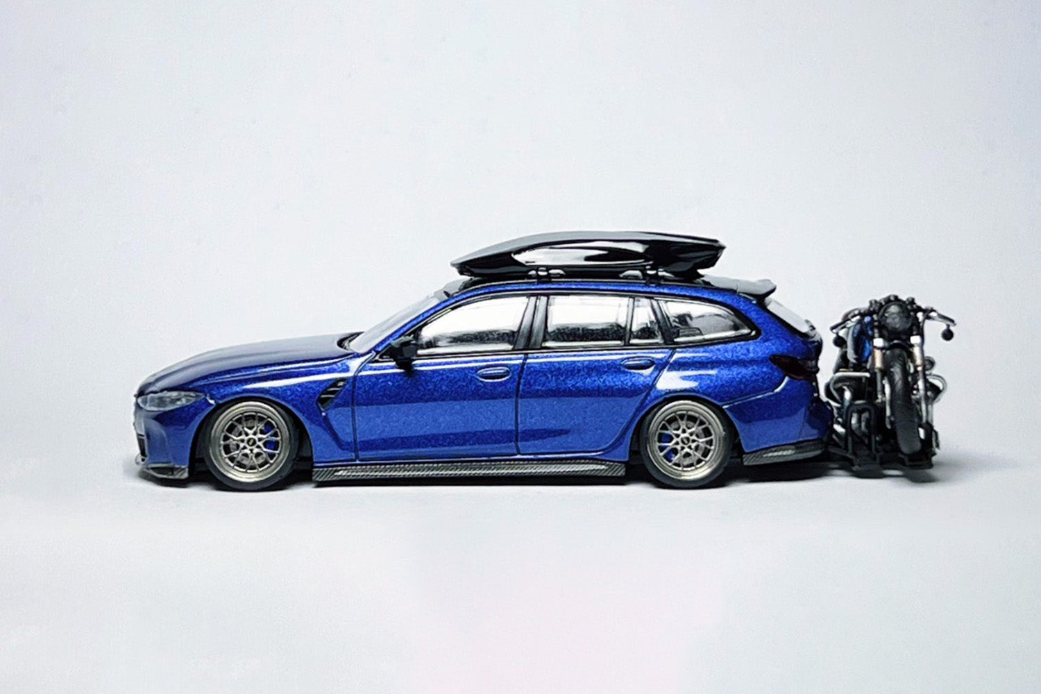 Custom 1:64 BMW M3 Touring 1090 diecast model with deep-dish wheels and roof cargo box