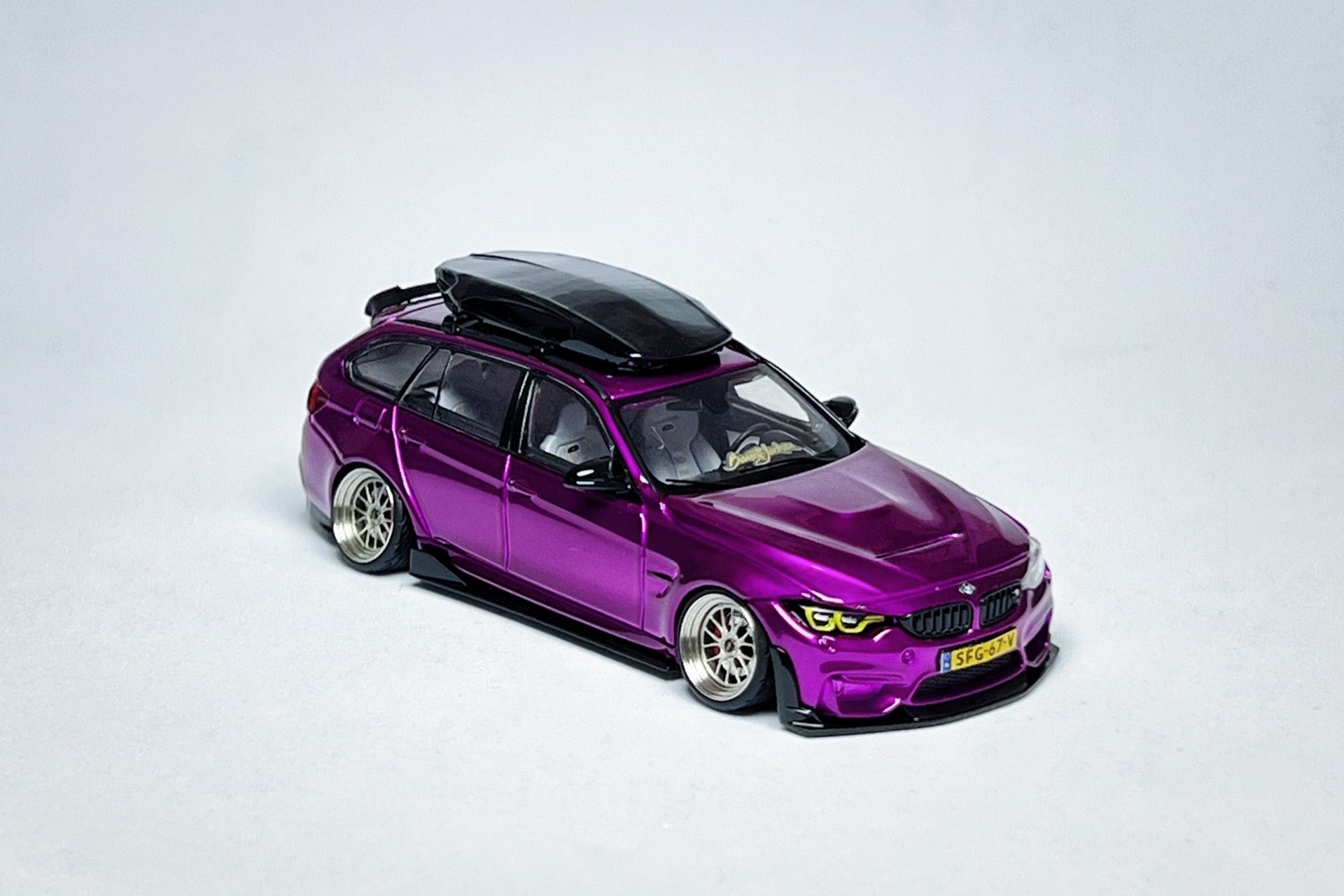 1:64 BMW F81 M3 CS Touring metallic purple custom diecast with visible license plate markings