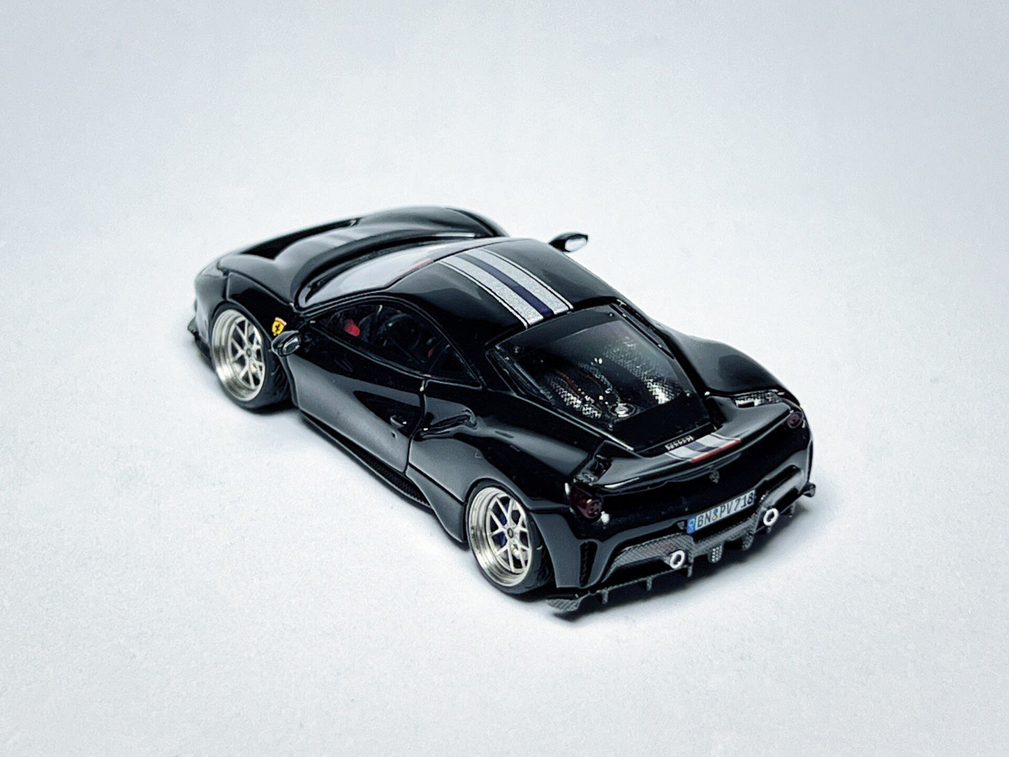 Wheel and rim detail on custom 1:64 Ferrari 488 Pista black diecast with deep-dish bearing wheels