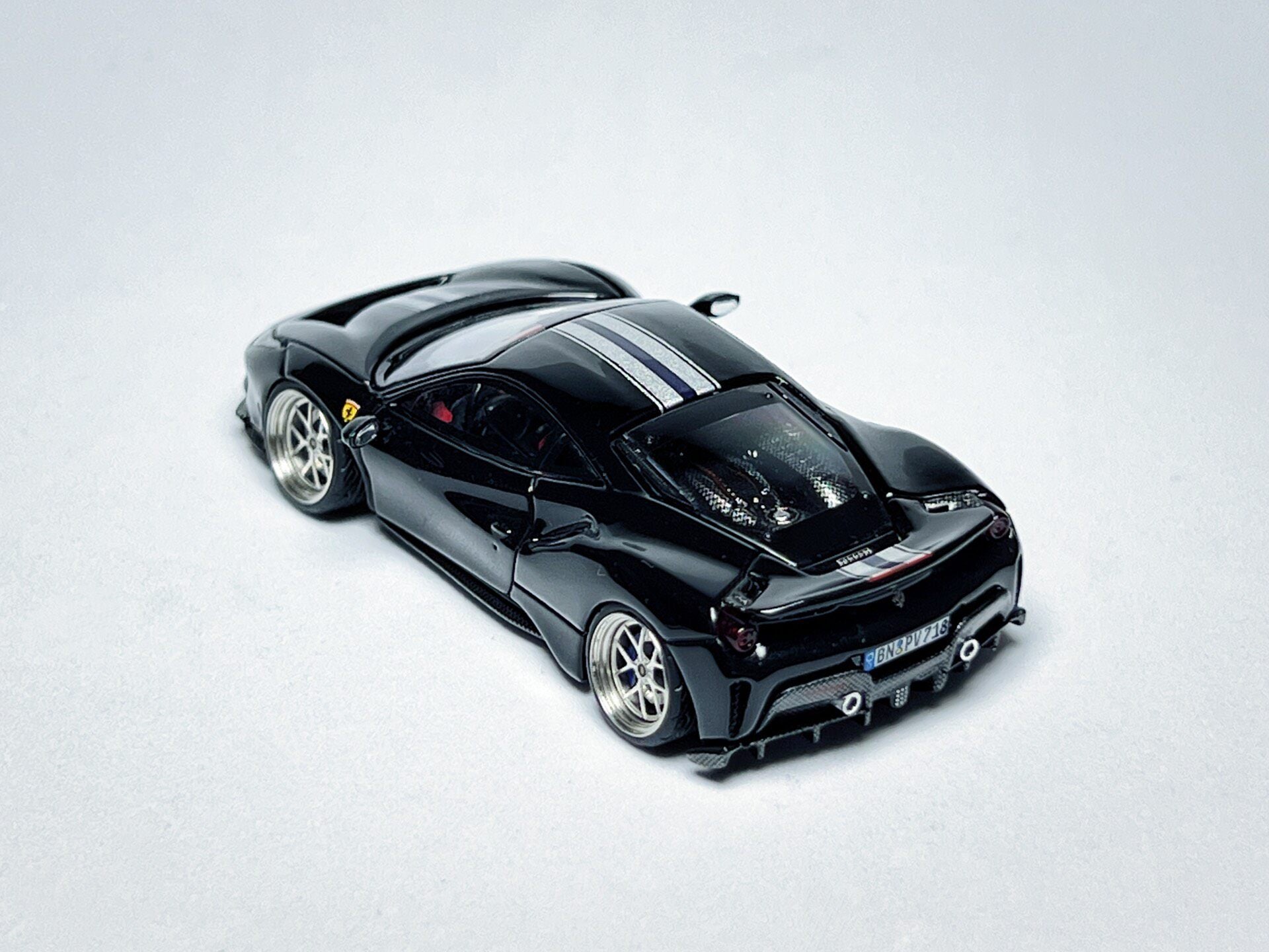 Wheel and rim detail on custom 1:64 Ferrari 488 Pista black diecast with deep-dish bearing wheels