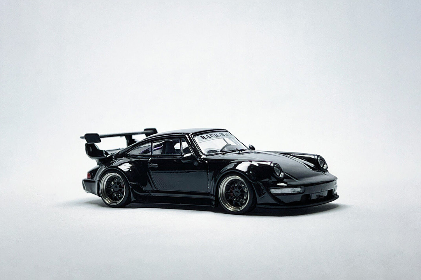 Custom 1:64 Porsche RWB 964 Black Bird diecast model with deep-dish bearing wheels