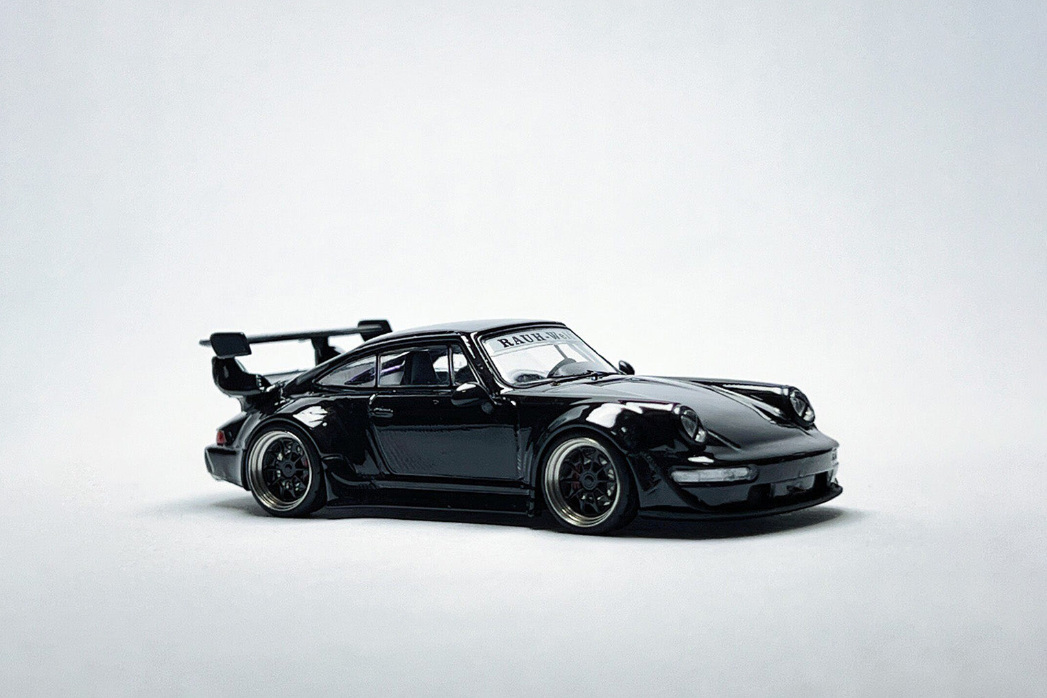 Custom 1:64 Porsche RWB 964 Black Bird diecast model with deep-dish bearing wheels