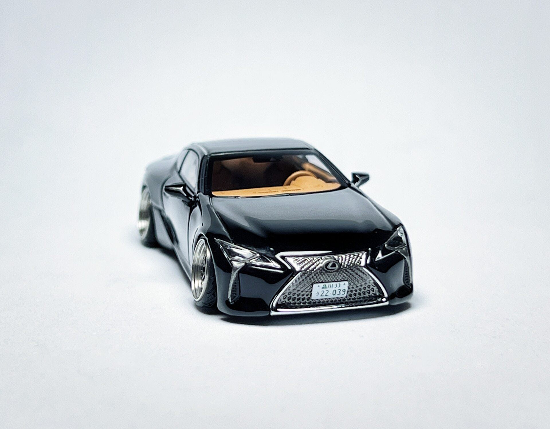 Custom 1:64 Lexus LC500 black diecast model with visible text markings