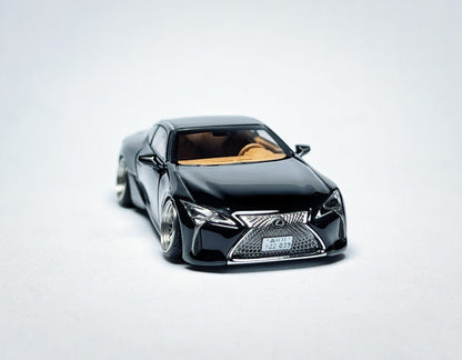 Custom 1:64 Lexus LC500 black diecast model with visible text markings