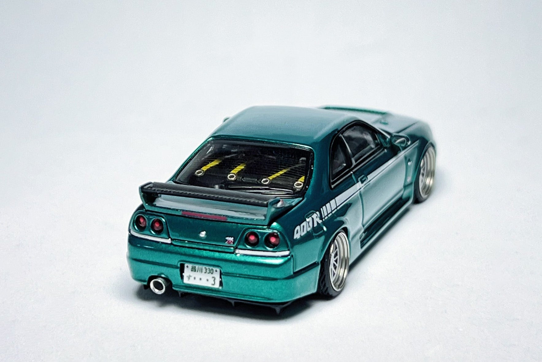 Custom 1:64 Nissan Skyline GT-R R33 400R green diecast model with decal details