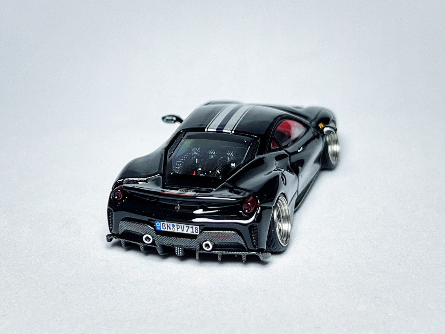 1:64 Ferrari 488 Pista black custom diecast model with visible license plate markings