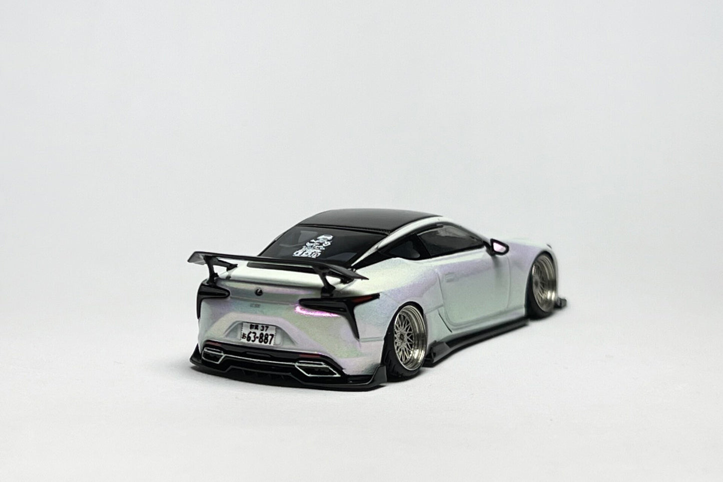 Custom 1:64 Lexus LC500 pearl white diecast model with visible text markings