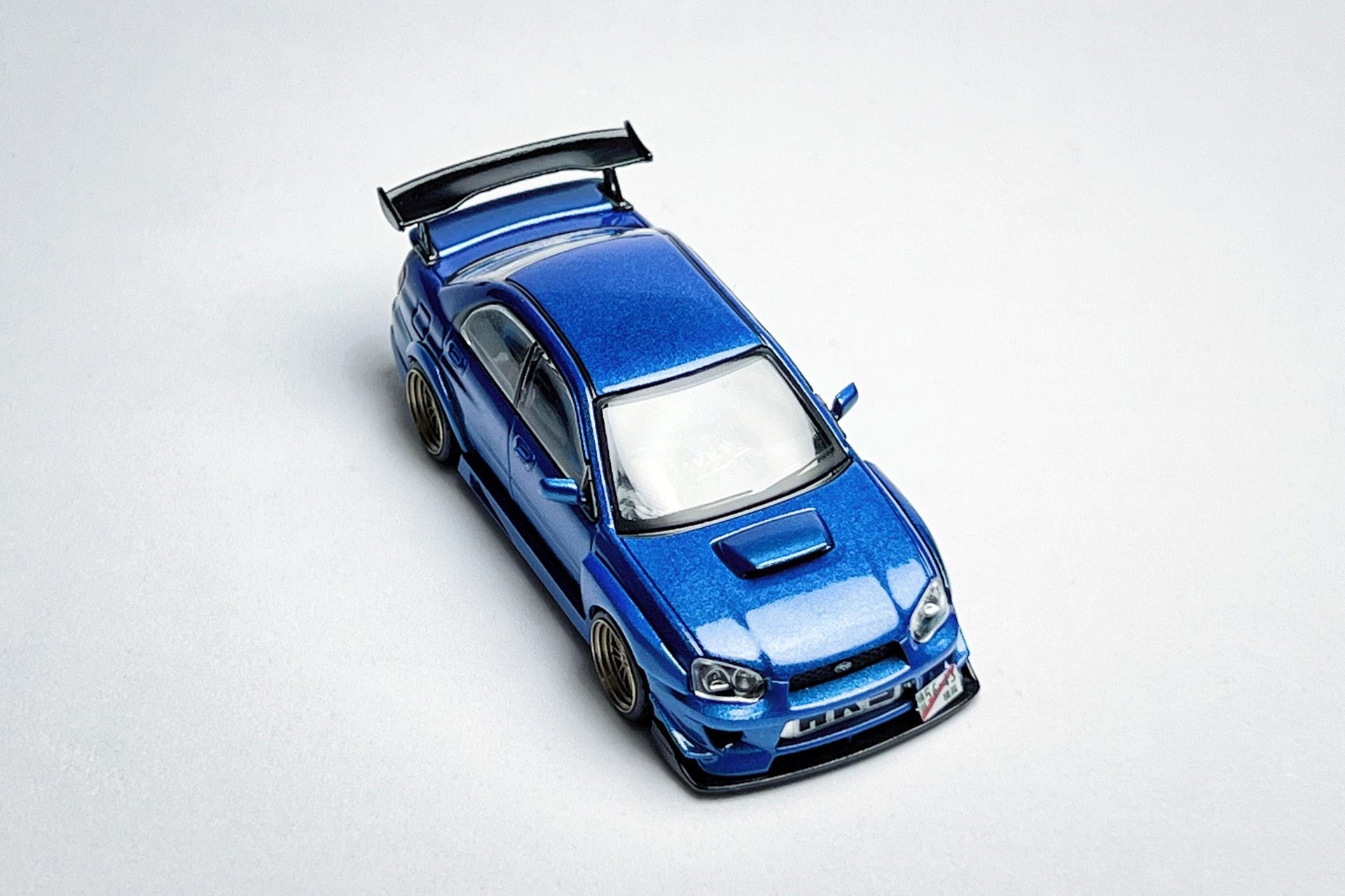 Custom 1:64 Subaru Impreza WRX STI metallic blue diecast model with M SPORTS kit
