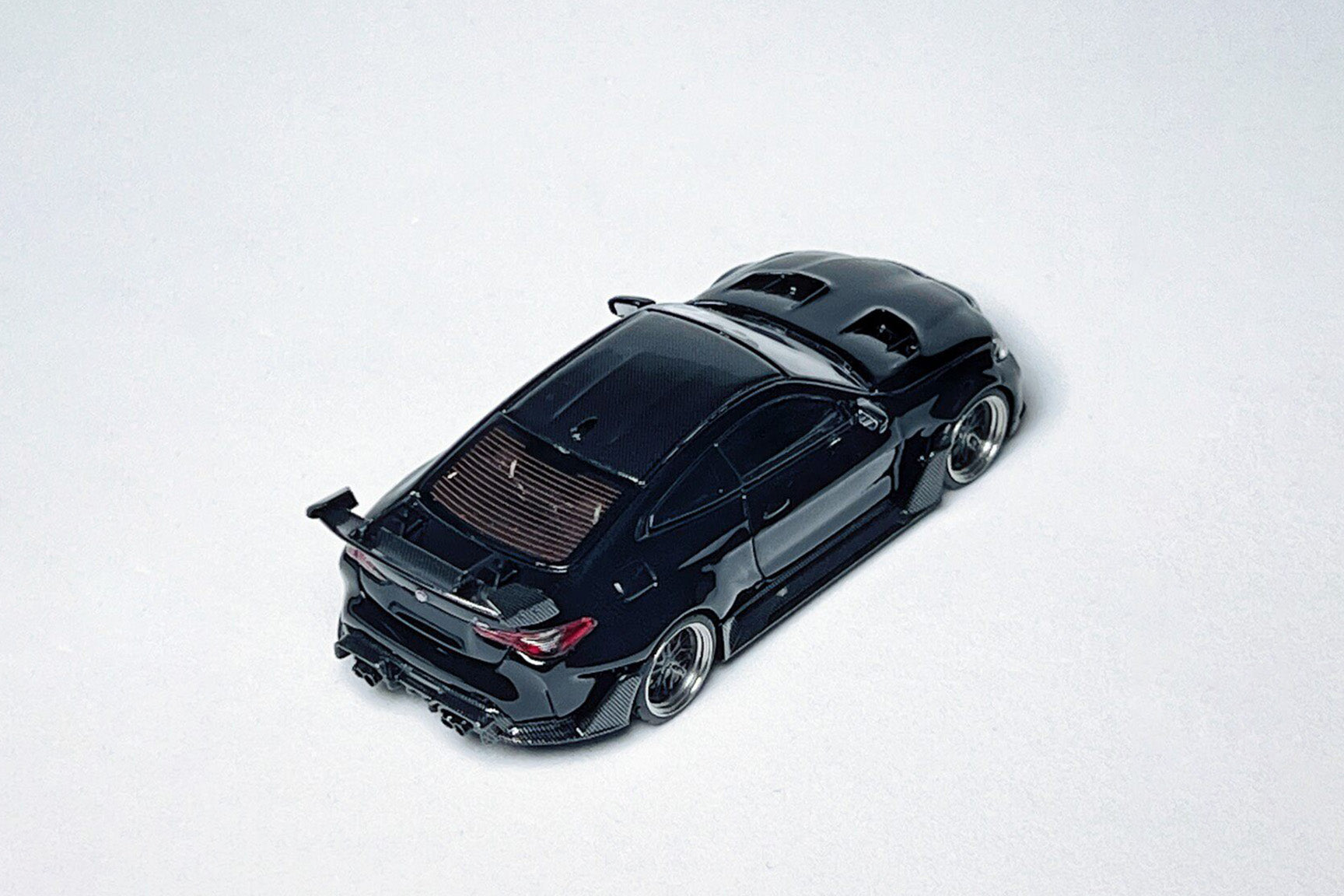 1:64 BMW G82 M4 ADRO widebody metallic black custom diecast model