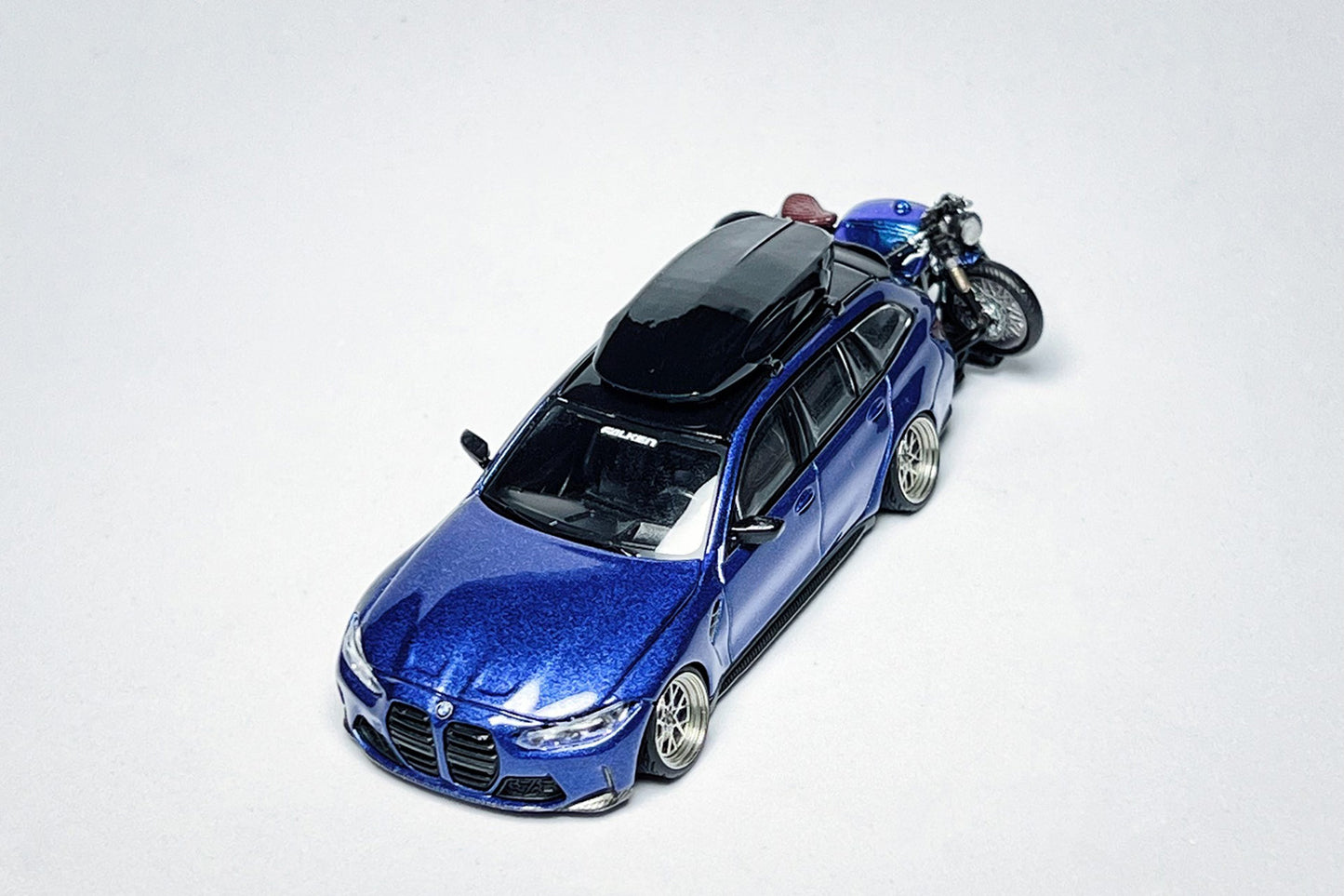 1:64 BMW M3 Touring 1090 custom diecast model with deep-dish wheels and roof cargo box