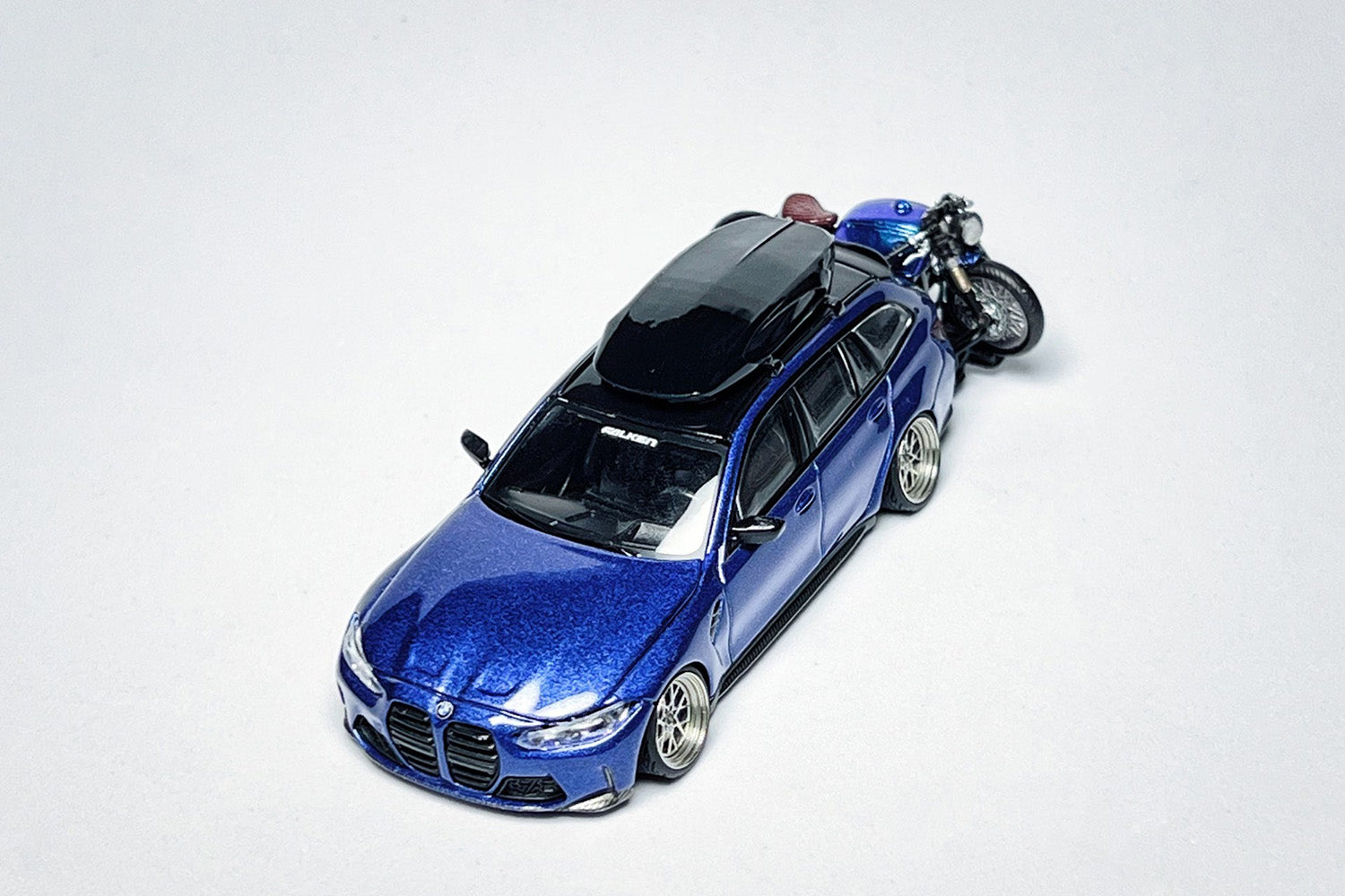 1:64 BMW M3 Touring 1090 custom diecast model with deep-dish wheels and roof cargo box