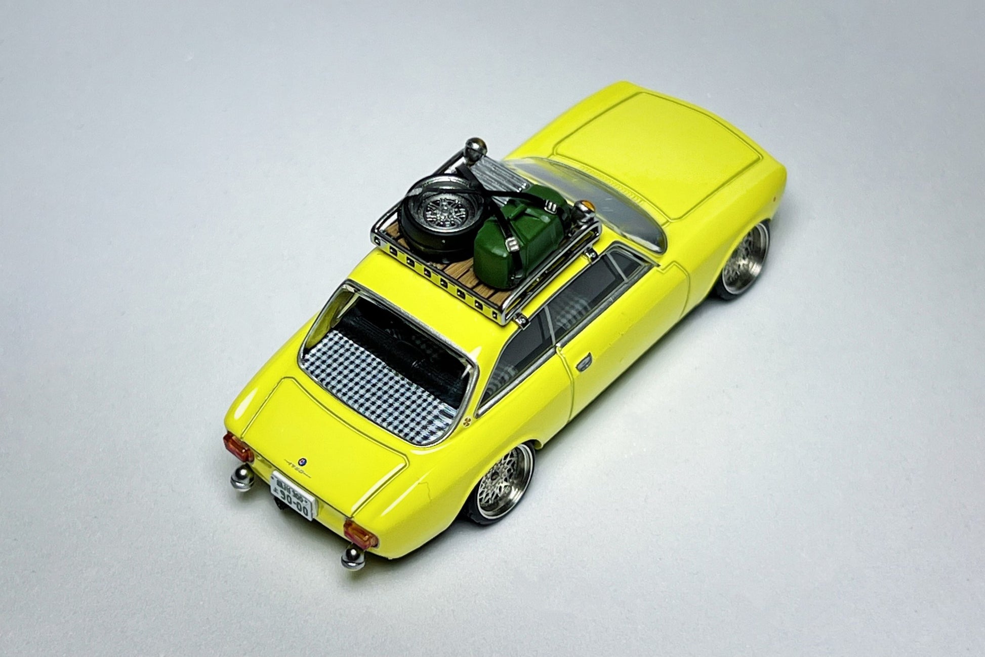 Custom 1:64 TLV Alfa Romeo 155c yellow rally diecast with deep-dish bearing wheels
