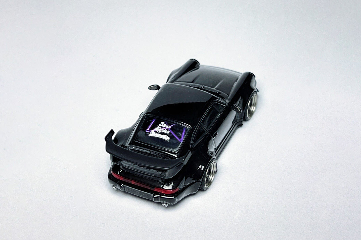 1:64 Porsche RWB 964 High Wing Black Bird custom diecast with deep-dish bearing wheels