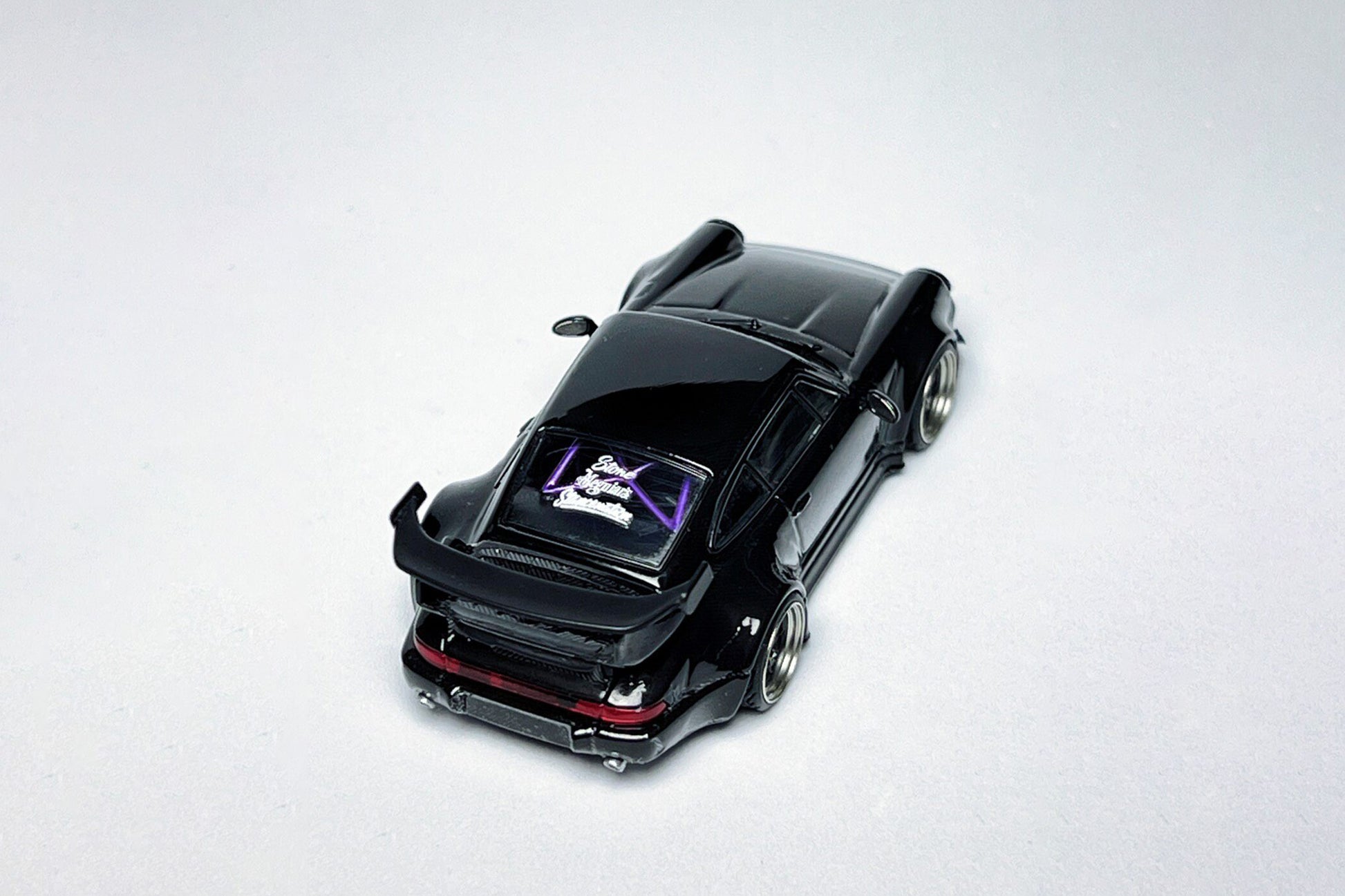1:64 Porsche RWB 964 High Wing Black Bird custom diecast with deep-dish bearing wheels