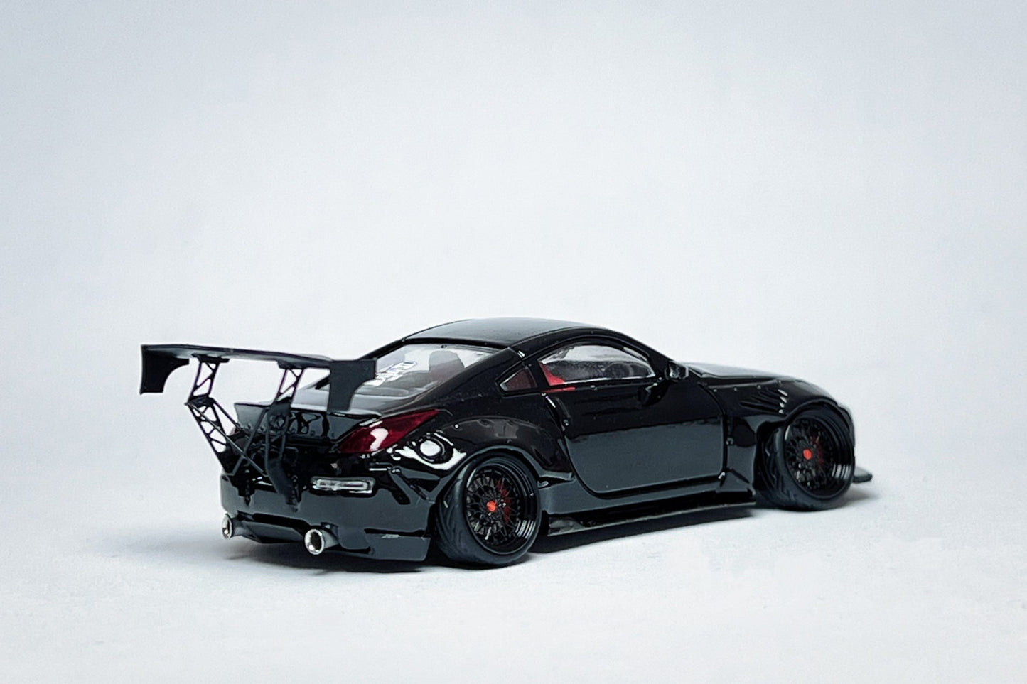 Custom 1:64 Nissan 350Z black widebody diecast Demon Lady Z with deep-dish wheels