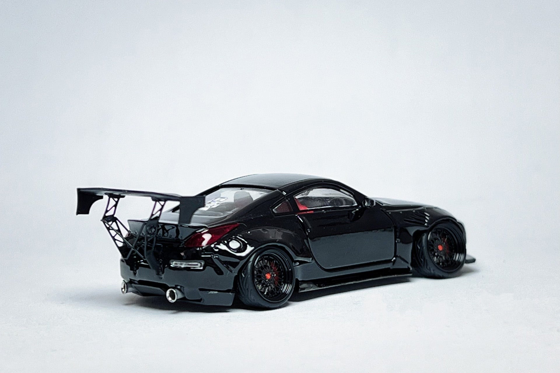 Custom 1:64 Nissan 350Z black widebody diecast Demon Lady Z with deep-dish wheels