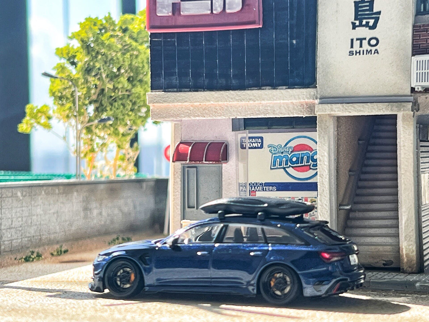 1:64 Audi RS6-R ABT 574 Navarra Blue custom diecast in outdoor scene